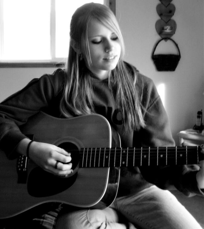 girl playing guitar